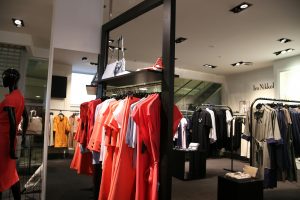 boutique displaying clothes widely spaced